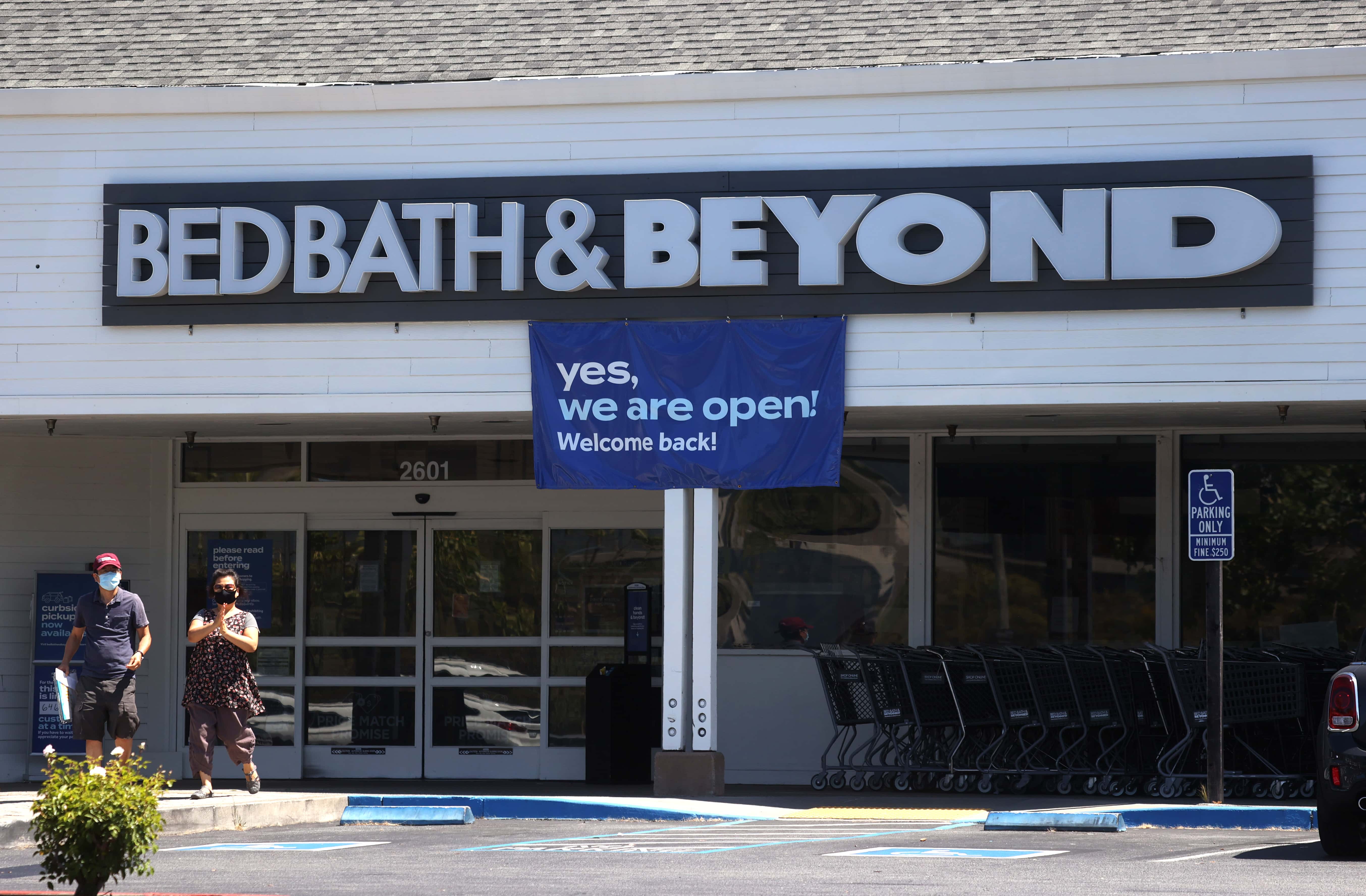 Customers leave a Bed Bath & Beyond store on July 09, 2020 in Larkspur, California. Bed Bath & Beyond announced that it plans to close 200 of its retail stores over the next year after seeing sales drop nearly 50 percent due to the coronavirus COVID-19 pandemic.