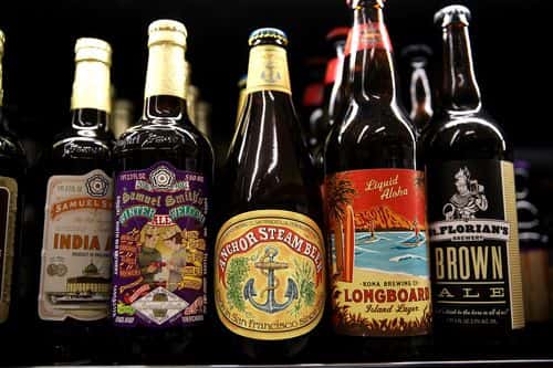 A bottle of Anchor Steam beer (C) is displayed on a shelf on August 3, 2017 in San Rafael, California. San Francisco based Anchor Brewing announced plans to sell to Japan's Sapporo Holdings Ltd for an undisclosed amount. Anchor Steam has brewed in San Francisco for 121 years.