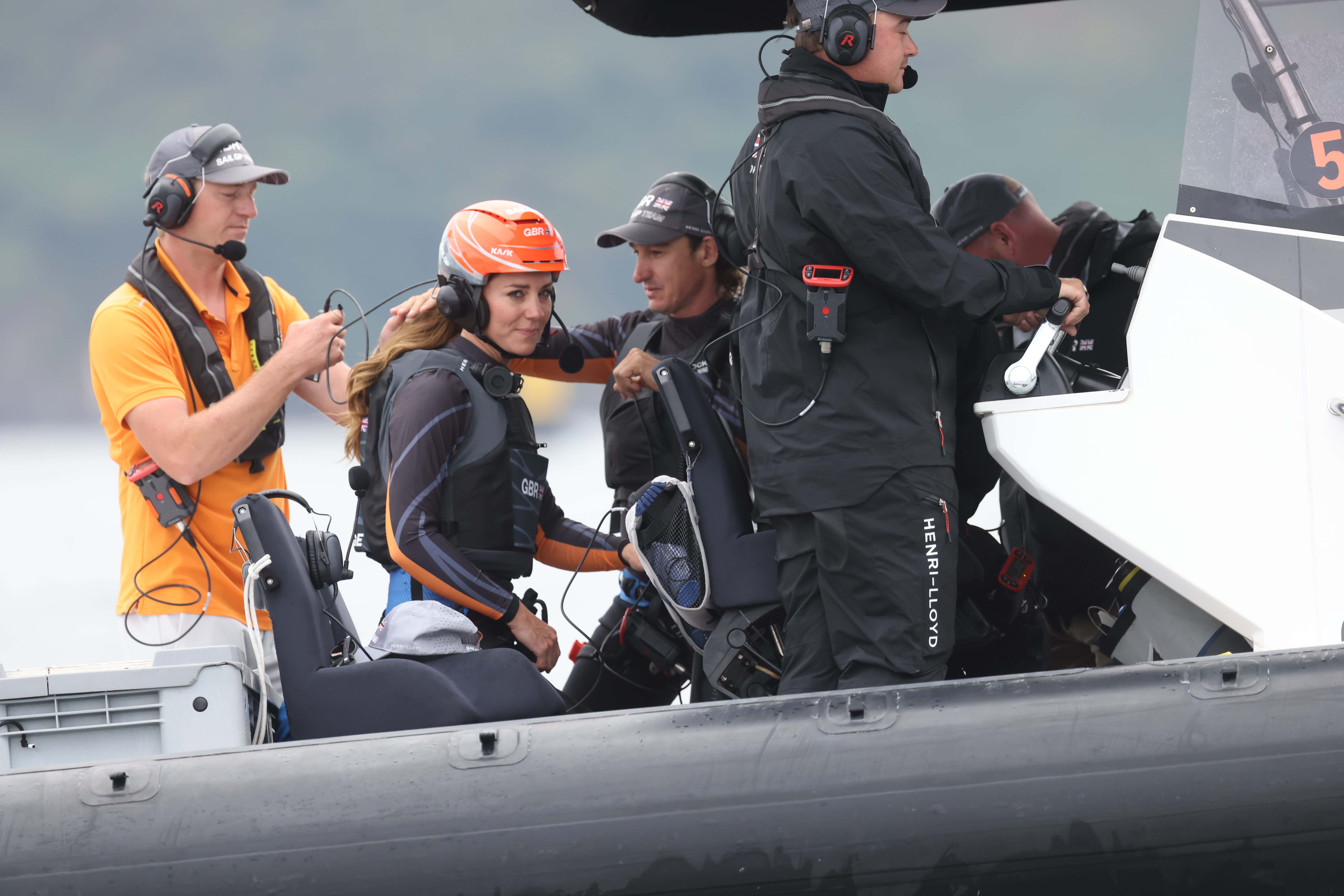 Catherine, Duchess Of Cambridge, (2L) visits the 1851 Trust and the Great Britain SailGP Team at Trinity Pier on July 31, 2022 in Plymouth, England. During the visit, the Duchess of Cambridge took part in activities educating young people about sustainability. (Photo by Jeff Gilbert - WPA Pool/Getty Images)