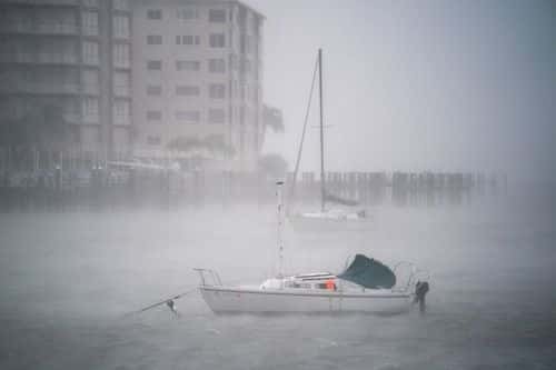 Wind gusts blow across boats in the Sarasota Bay as Hurricane Ian churns to the south on September 28, 2022 in Sarasota, Florida. The storm made a U.S. landfall at Cayo Costa, Florida this afternoon as a Category 4 hurricane with wind speeds over 140 miles per hour in some areas.