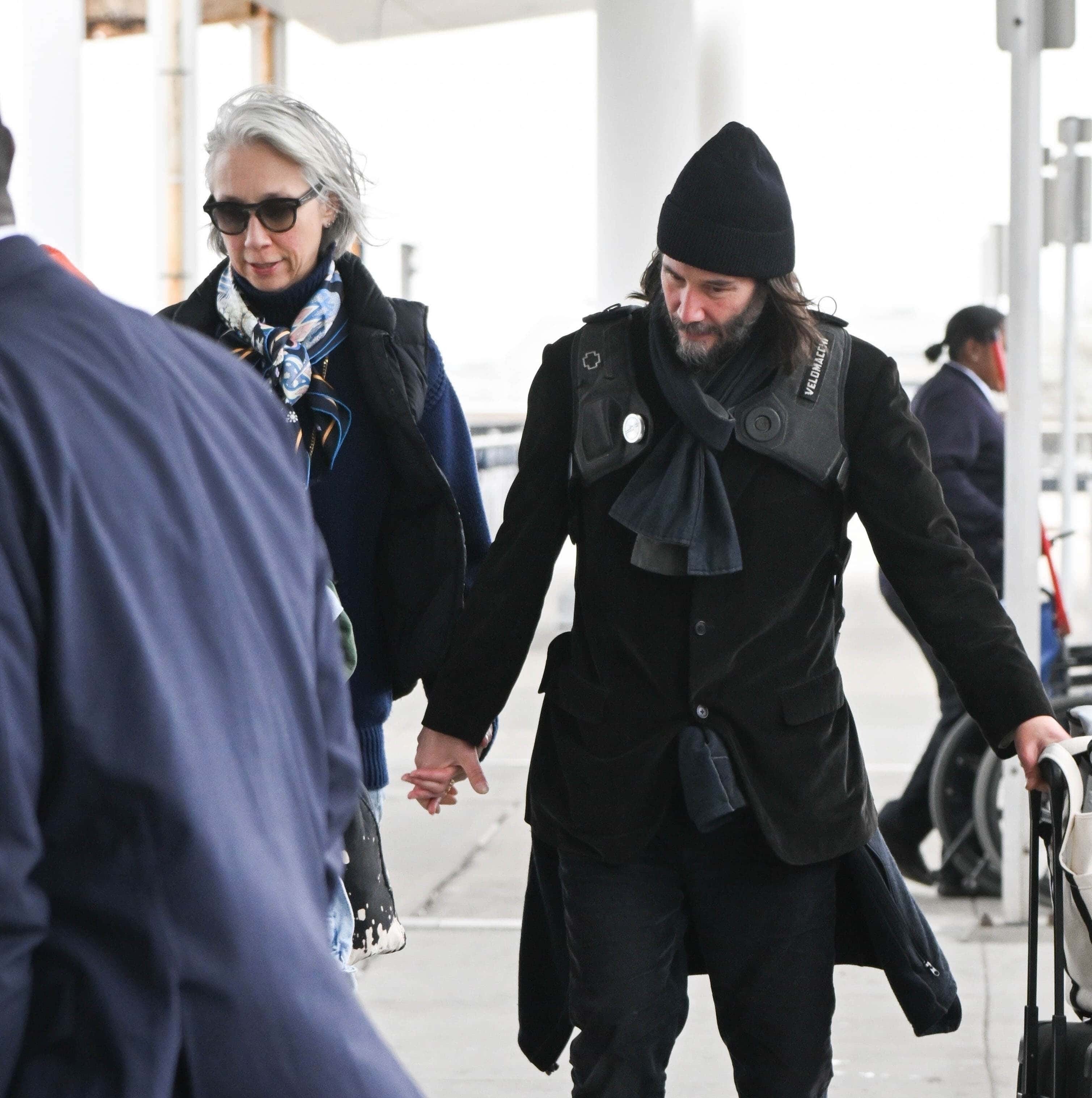 Keanu Reeves and his girlfriend Alexandra Grant looked cozy as they arrived at JFK International Airport on April 28 (Backgrid)