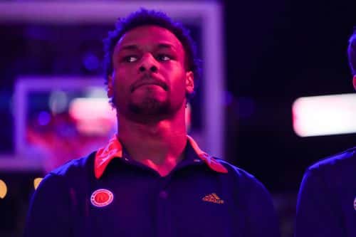 Bronny James #6 of the West team looks on during the national anthem prior to the of the 2023 McDonald's High School Boys All-American Game at Toyota Center on March 28, 2023 in Houston, Texas.