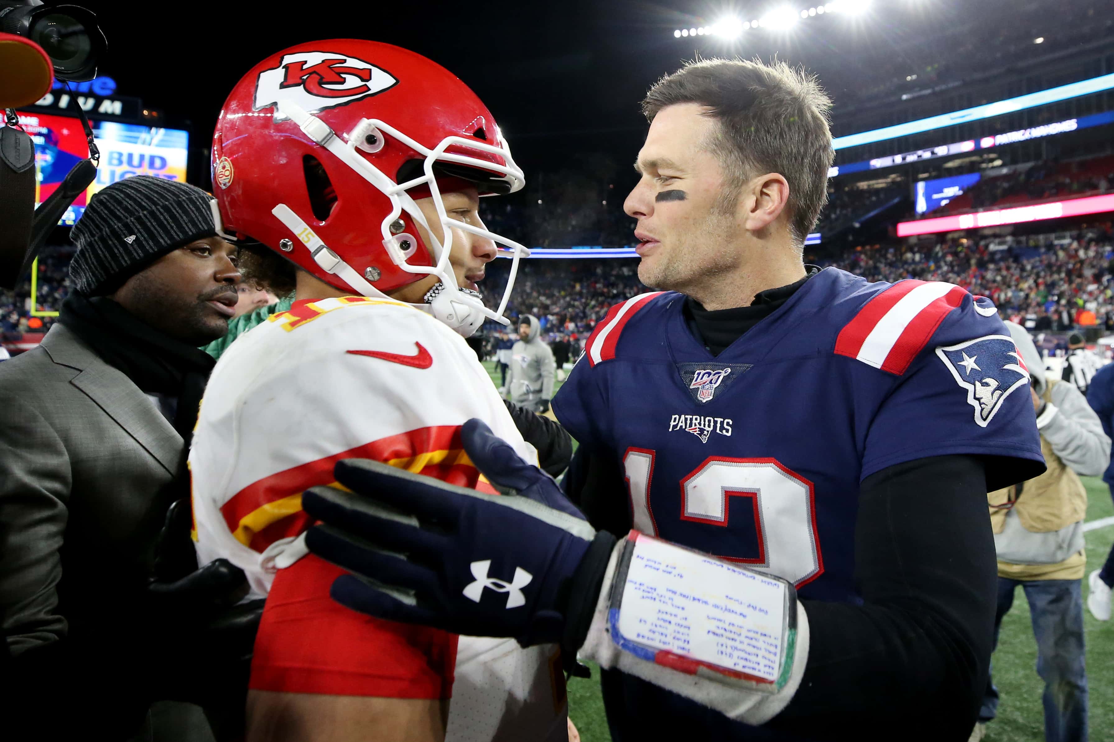 Tom Brady #12 of the New England Patriots talks with Patrick Mahomes #15 of the Kansas City Chiefs after the Chief defeat the Patriots 23-16 at Gillette Stadium on December 08, 2019 in Foxborough, Massachusetts.