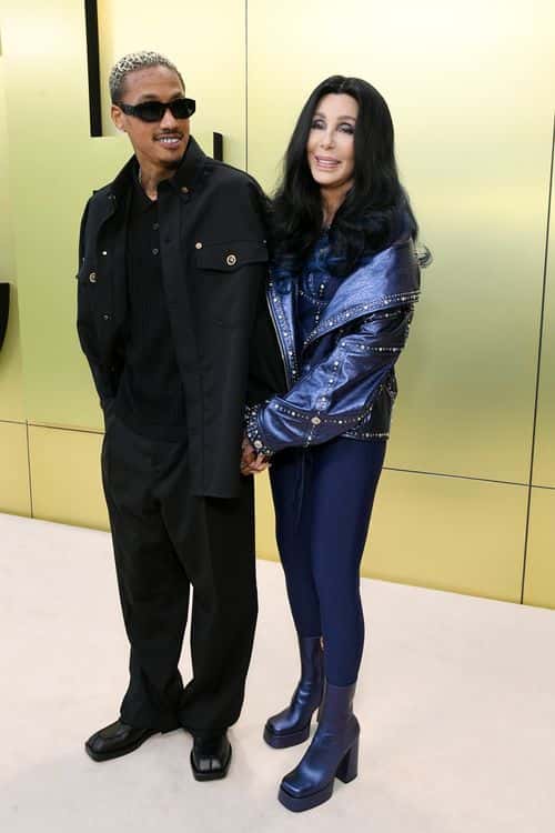 (L-R) Alexander Edwards and Cher attend the Versace FW23 Show at Pacific Design Center on March 09, 2023 in West Hollywood, California. (Photo by Jon Kopaloff/Getty Images)