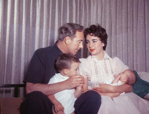 Actors Elizabeth Taylor (1932 - 2011) and Michael Wilding (1912 - 1979) with their sons Michael Jr (left) and newborn Christopher, Los Angeles, California, 1955. (Photo by Hulton Archive/Getty Images)