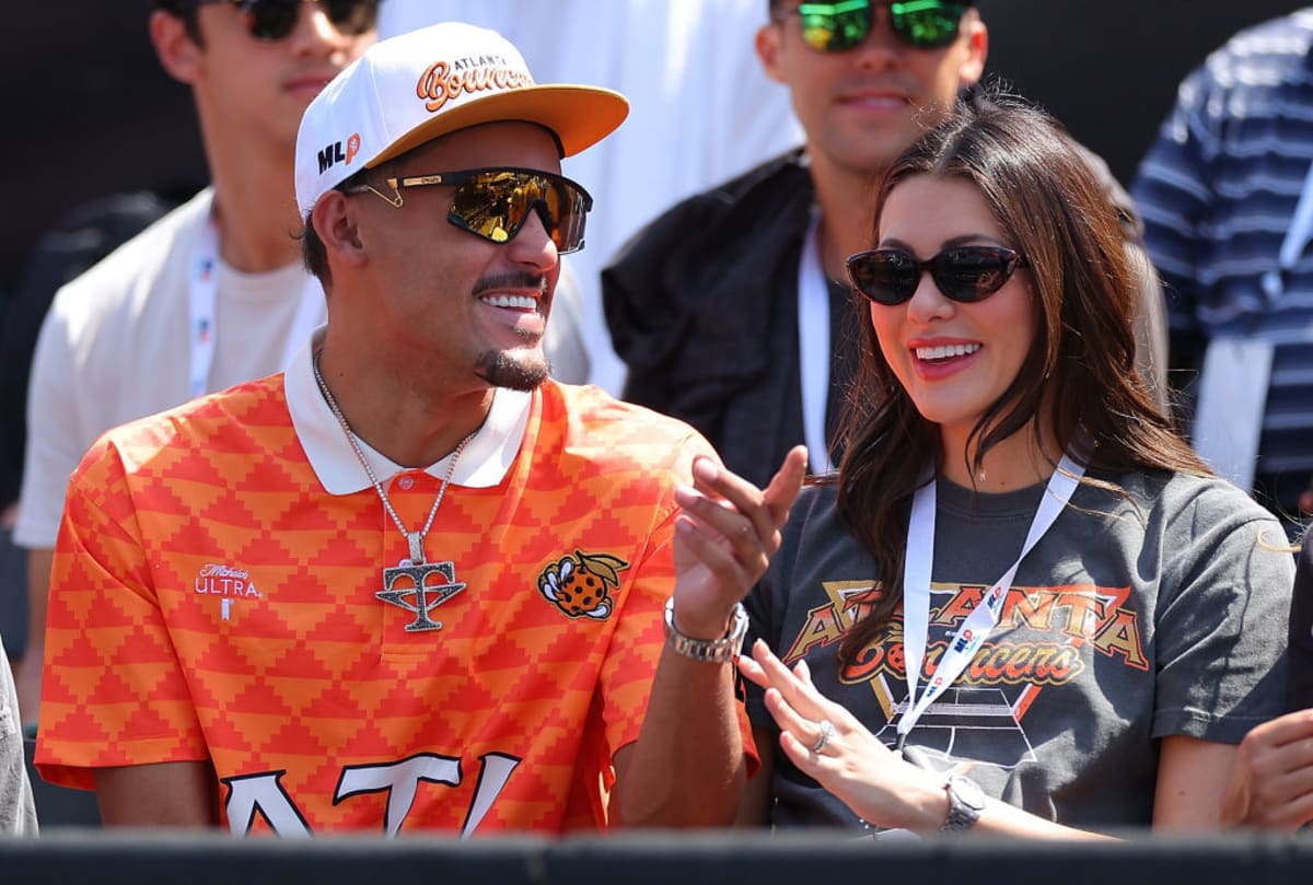 Trae Young of the Atlanta Hawks looks on as a new co-owner of the Atlanta Bouncers with his wife Shelby Miller on September 22, 2023 in Peachtree Corners, Georgia. (Photo by Kevin C. Cox/Getty Images)