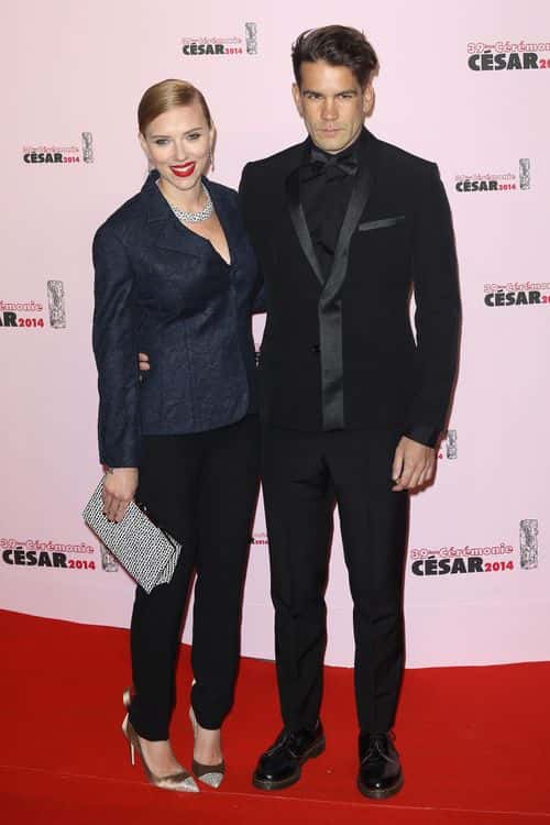 (L-R) Scarlett Johansson and  Romain Dauriac arrive for the 39th Cesar Film Awards 2014 at Theatre du Chatelet on February 28, 2014 in Paris, France.