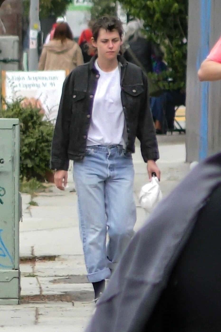 The 33-year-old Twilight star went for a double denim look, teaming a black jacket with a pair of fashionably faded blue jeans (Backgrid)