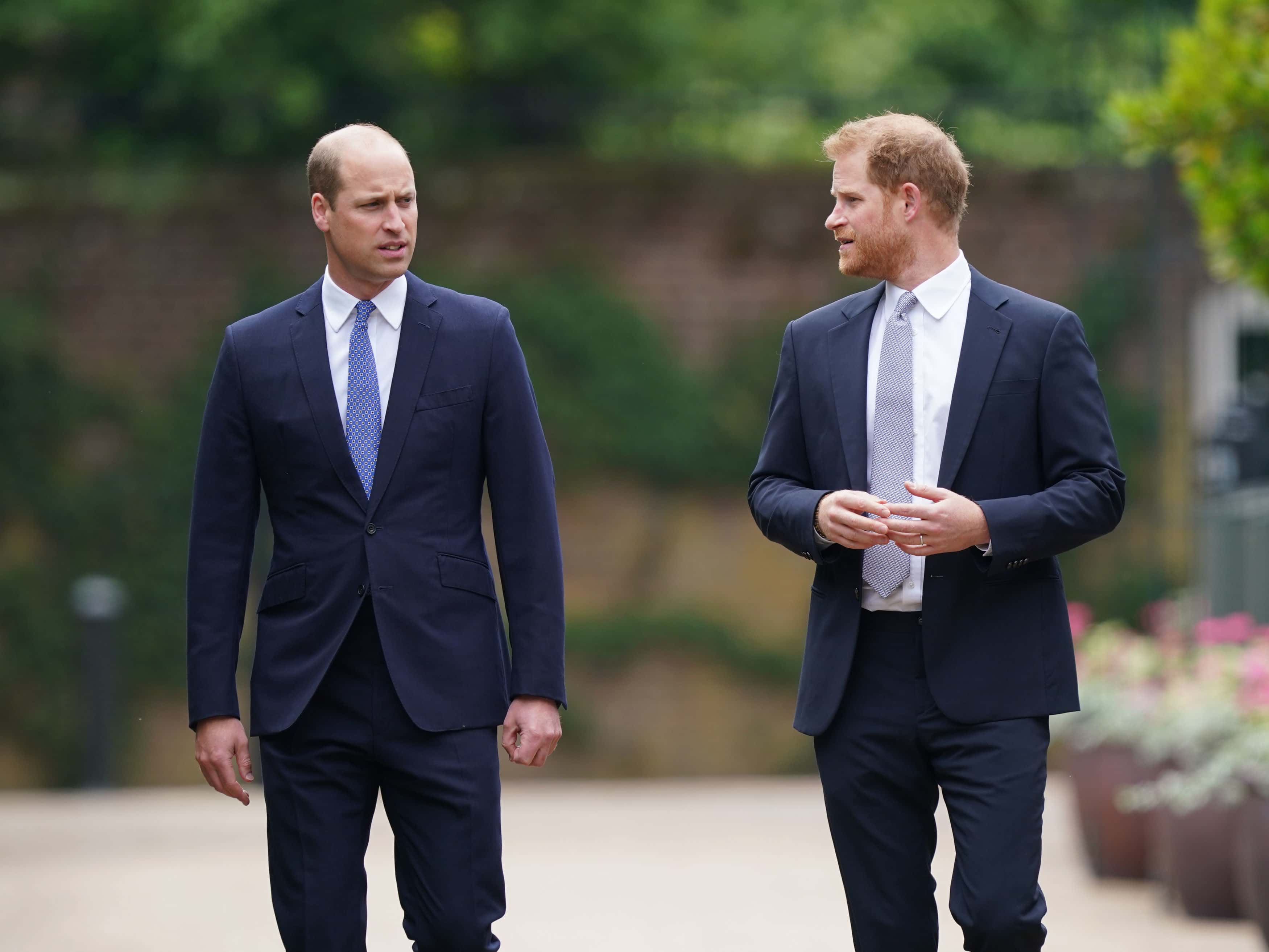 Prince William, Duke of Cambridge (left) and Prince Harry, Duke of Sussex arrive for the unveiling of a statue they commissioned of their mother Diana, Princess of Wales, in the Sunken Garden at Kensington Palace, on what would have been her 60th birthday on July 1, 2021 in London, England. Today would have been the 60th birthday of Princess Diana, who died in 1997. At a ceremony here today, her sons Prince William and Prince Harry, the Duke of Cambridge and the Duke of Sussex respectively, will unveil a statue in her memory. (Photo by Yui Mok - WPA Pool/Getty Images)