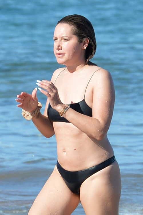 Ashley Tisdale goes for a dip in the beach. (Backgrid)