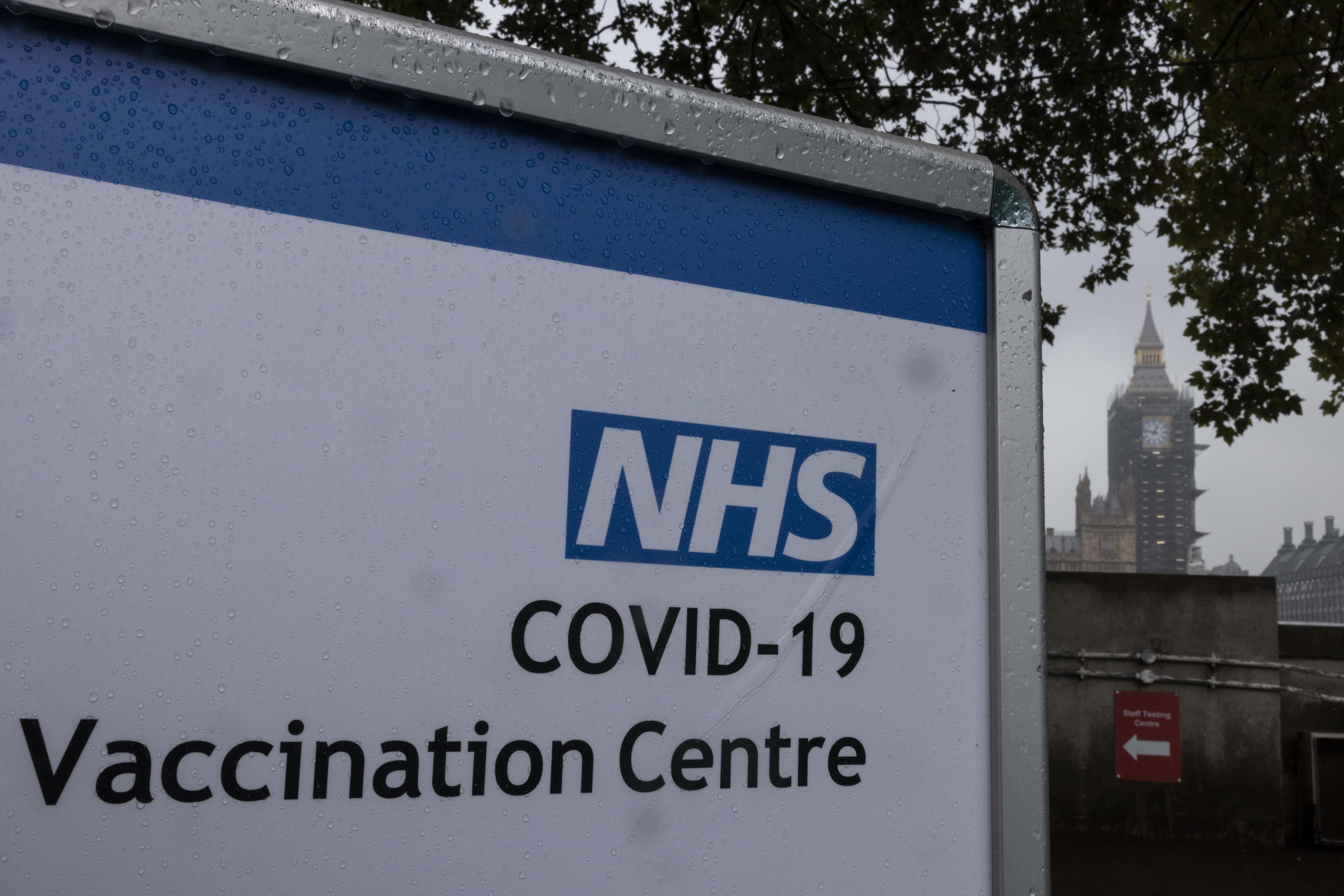 A Covid-19 vaccination centre sign stands at St Thomas' hospital opposite Westminster on September 13, 2021 in London, United Kingdom. Tomorrow, British Prime Minister Boris Johnson will set out his plan to manage Covid-19 through the winter, including what actions would need to be taken if the NHS hospital system were at risk of being overwhelmed.