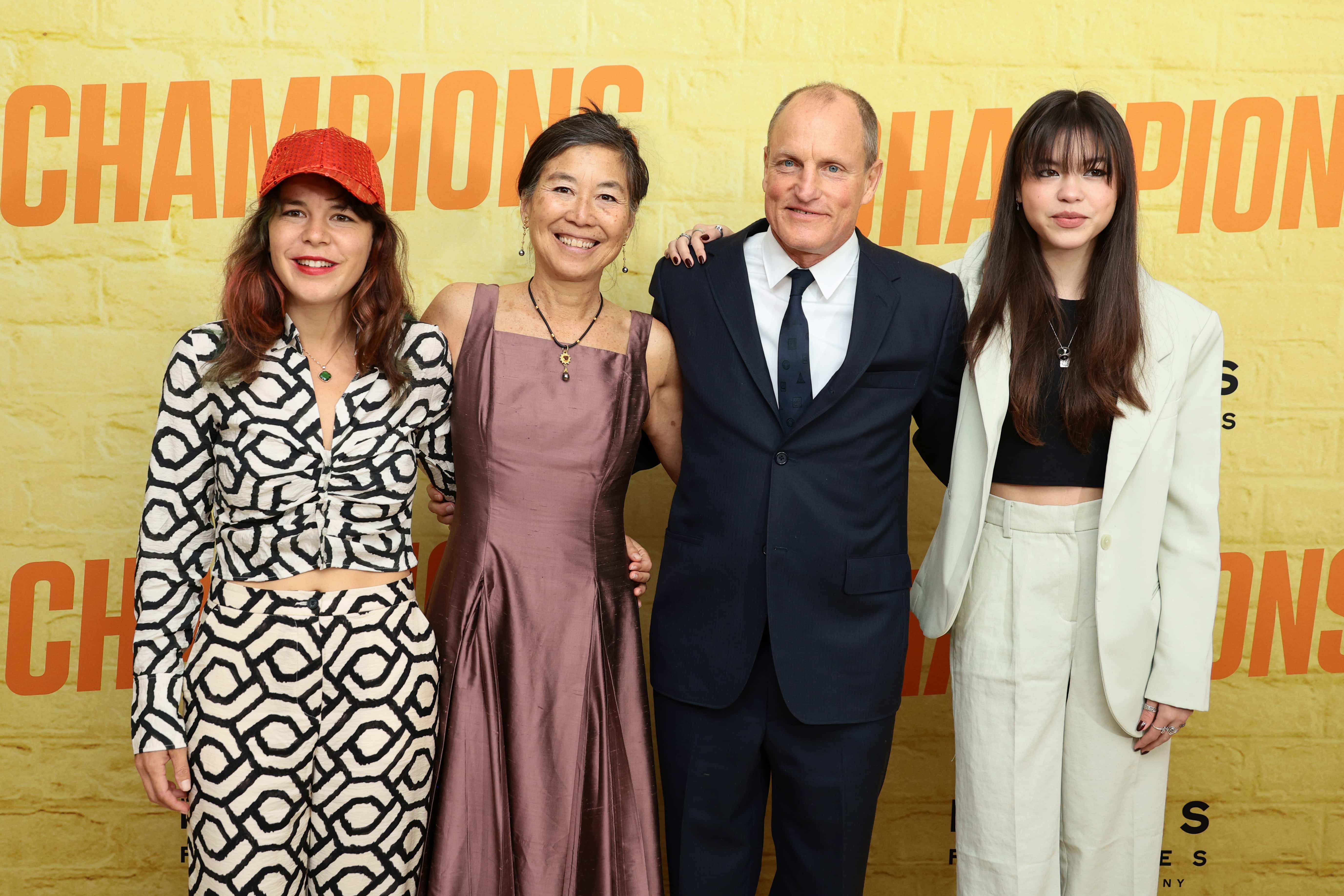 Laura Louie (2nd from L) and Woody Harrelson (3rd from L) attend the premiere of