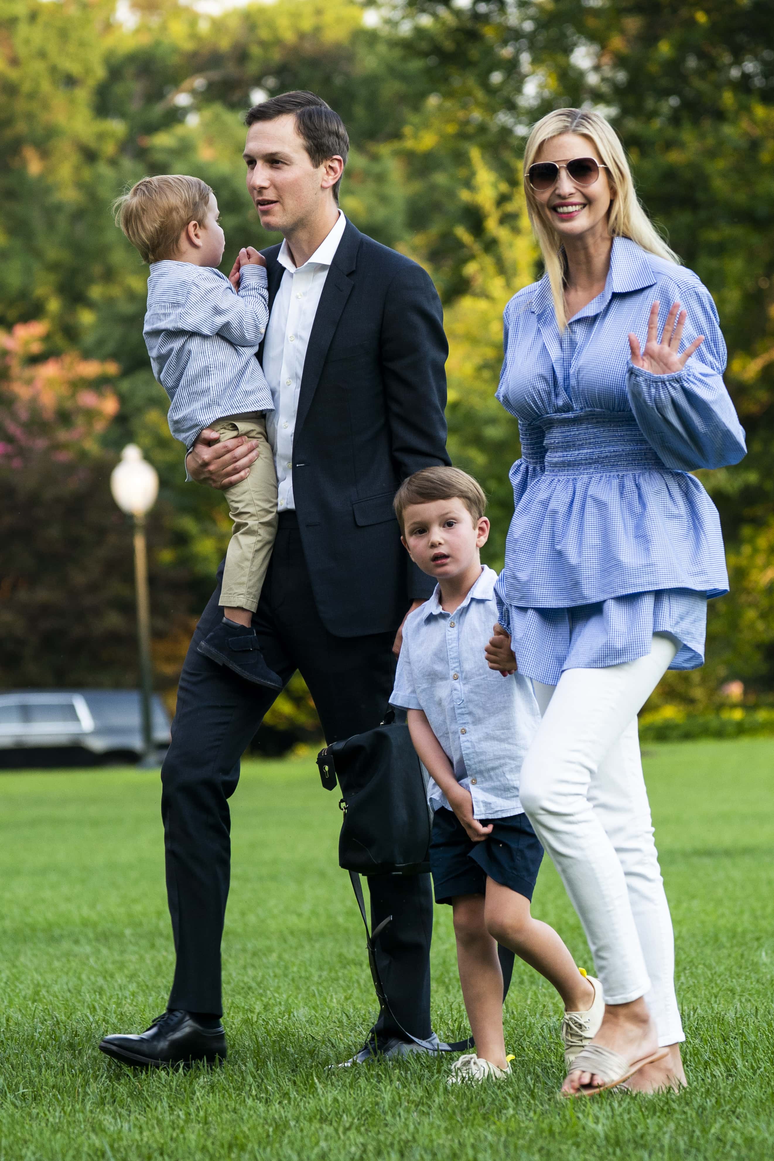 Jared Kushner (C-L) and Ivanka Trump (R) walk with their children Theodore (L) and Joseph (C-R) across the South Lawn as they return from a weekend stay in Bedminster, New Jersey at the White House on July 29, 2018 in Washington, DC. Earlier in the day, the President Donald Trump once again went after the media on Twitter, calling them the 'enemy of the people.'