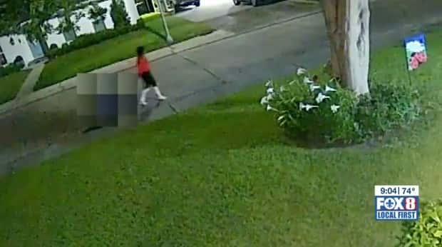 Chilling CCTV footage shows a woman dragging a wagon with a bucket on the back (Fox 8/screengrab)