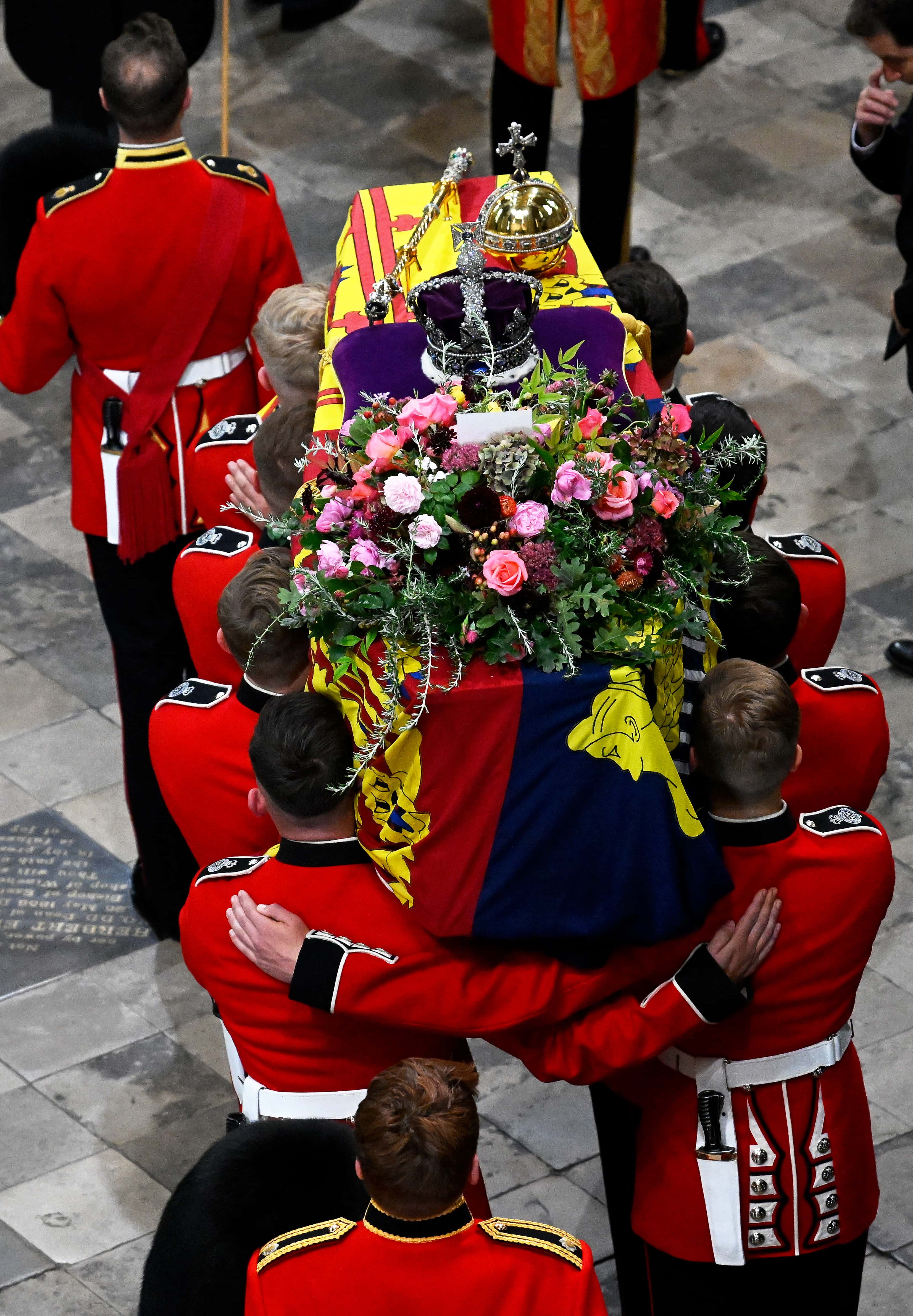 The coffin of Queen Elizabeth II with the Imperial State Crown resting on top is carried by the Bearer Party into Westminster Abbey during the State Funeral of Queen Elizabeth II on September 19, 2022 in London, England. Elizabeth Alexandra Mary Windsor was born in Bruton Street, Mayfair, London on 21 April 1926. She married Prince Philip in 1947 and ascended the throne of the United Kingdom and Commonwealth on 6 February 1952 after the death of her Father, King George VI. Queen Elizabeth II died at Balmoral Castle in Scotland on September 8, 2022, and is succeeded by her eldest son, King Charles III.