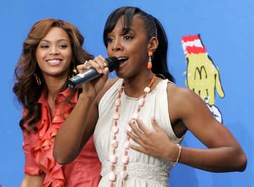 Singers Beyonce Knowles and Kelly Rowland of Destiny's Child perform at the 2005 World Children's Day at the McDonalds Los Angeles Ronald McDonald House on November 15, 2005 in Los Angeles, California.