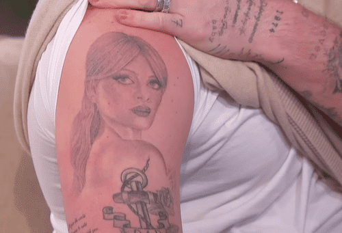 The 24-year-old son of soccer player David Beckham removed his sweater to show off his latest ink - a large portrait of Nicola, 28, on his arm (jenniferhudsonshow/Youtube)