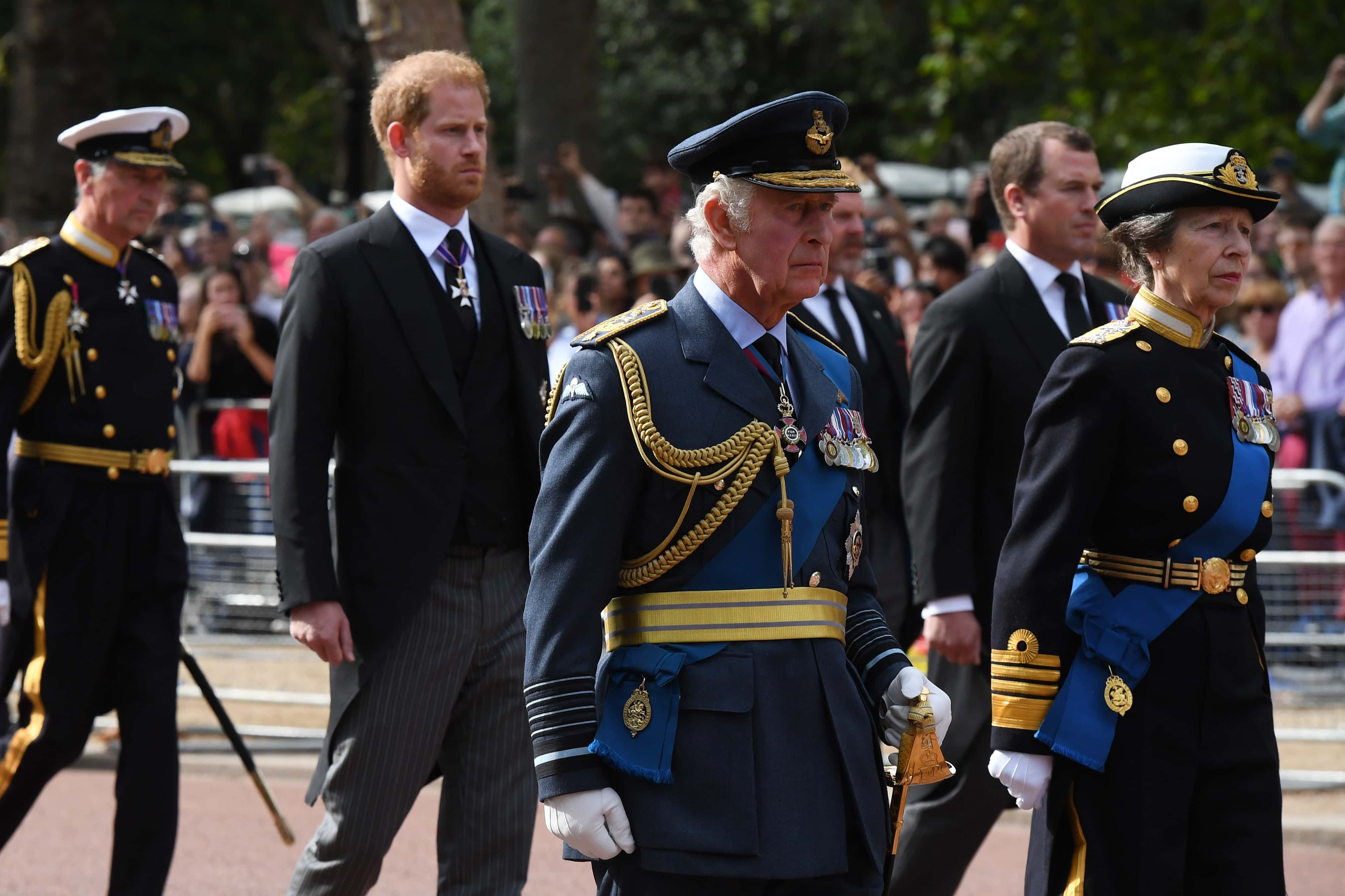 Vice Admiral, Sir Timothy Lawrence, Prince Harry, Duke of Sussex, Peter Phillips, King Charles III and Princess Anne, Princess Royal walk behind the coffin during the procession for the Lying-in State of Queen Elizabeth II on September 14, 2022 in London, England. Queen Elizabeth II's coffin is taken in procession on a Gun Carriage of The King's Troop Royal Horse Artillery from Buckingham Palace to Westminster Hall where she will lay in state until the early morning of her funeral. Queen Elizabeth II died at Balmoral Castle in Scotland on September 8, 2022, and is succeeded by her eldest son, King Charles III.