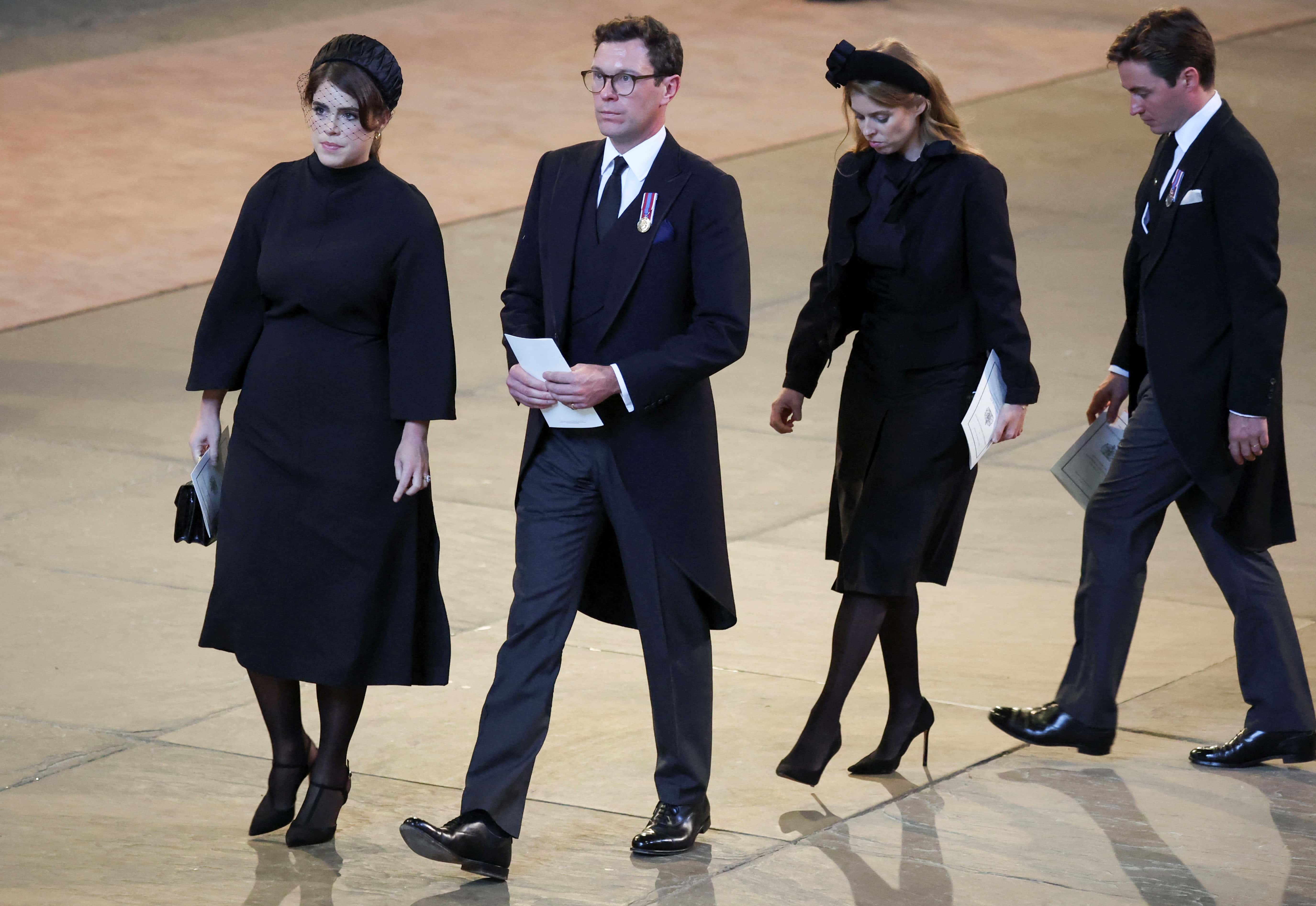 (L-R) Princess Eugenie, her husband Jack Brooksbank, Princess Beatrice and husband Edoardo Mapelli Mozzi walk as procession with the coffin of Britain's Queen Elizabeth arrives at Westminster Hall from Buckingham Palace for her lying in state on September 14, 2022 in London, United Kingdom. Queen Elizabeth II's coffin is taken in procession on a Gun Carriage of The King's Troop Royal Horse Artillery from Buckingham Palace to Westminster Hall where she will lay in state until the early morning of her funeral. Queen Elizabeth II died at Balmoral Castle in Scotland on September 8, 2022, and is succeeded by her eldest son, King Charles III.