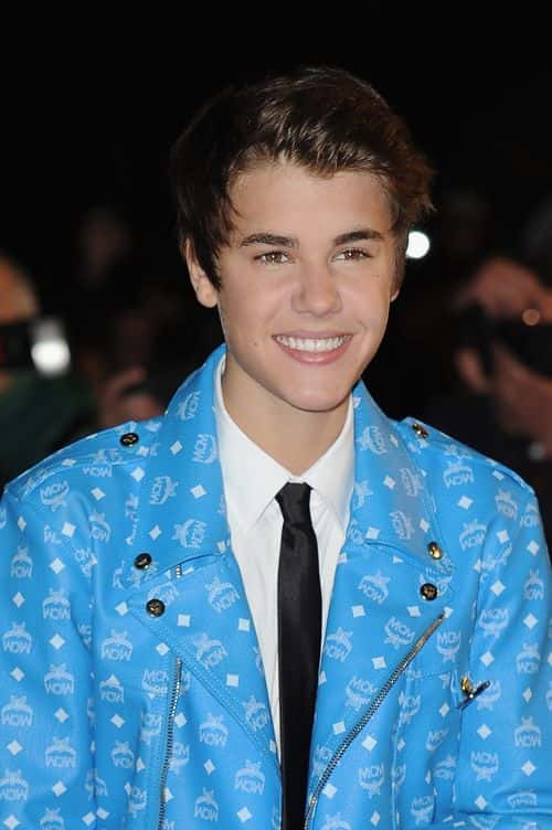 Justin Bieber poses as he arrives at NRJ Music Awards 2012 at Palais des Festivals on January 28, 2012 in Cannes, France.
