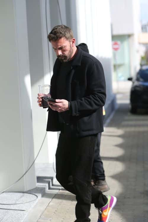 Ben Affleck on his way to a meeting with a large coffee. (Backgrid)