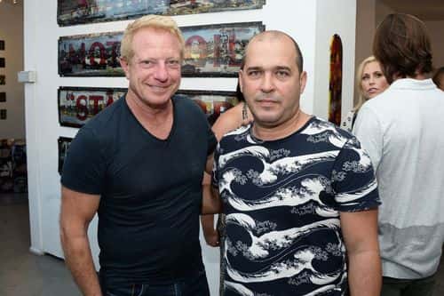 Robert Flaxman (L) and artist Kadir Lopez attend Kadir Lopez's Art Show on August 12, 2016 in West Hollywood, California.