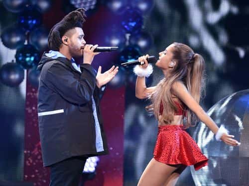 Recording artists The Weeknd (L) and Ariana Grande perform onstage during KIIS FM's Jingle Ball 2014  powered by LINE at Staples Center on December 5, 2014 in Los Angeles, California.