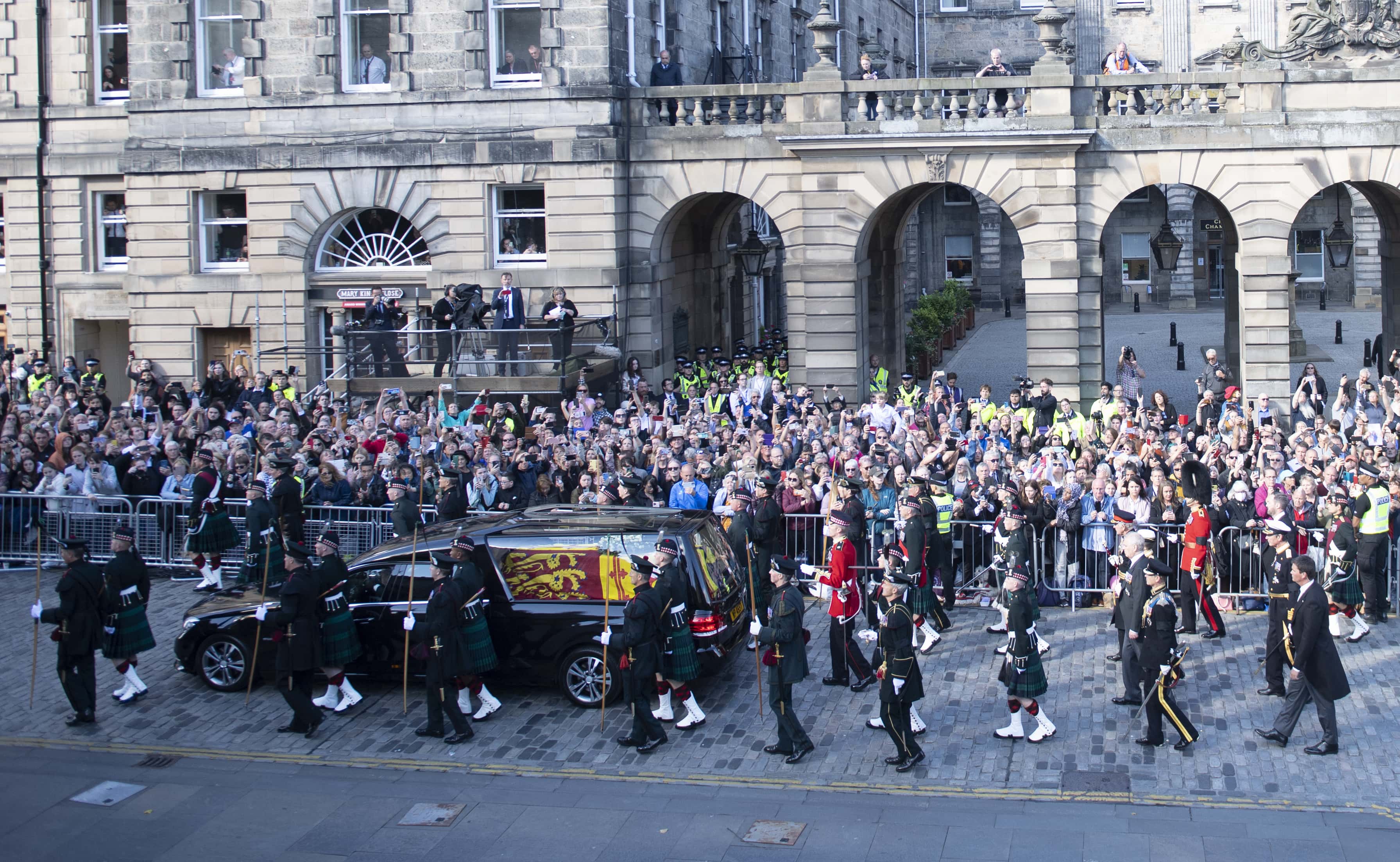 Britain's King Charles III, Britain's Princess Anne, Princess Royal, Britain's Prince Andrew, Duke of York, Britain's Prince Edward, Earl of Wessex and Vice Admiral Timothy Laurence walk behind the hearse carrying Queen Elizabeth II's coffin as it moves along the Royal Mile during the procession from Palace of Holyroodhouse to St Giles' Cathedral on September 12, 2022 in Edinburgh, Scotland. (Photo by Lesley Martin - WPA Pool/Getty Images)