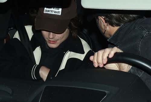 DiCaprio kept a low profile while driving, wearing all black while Chalamet looked chill in a jacket and brown baseball cap. (Backgrid)