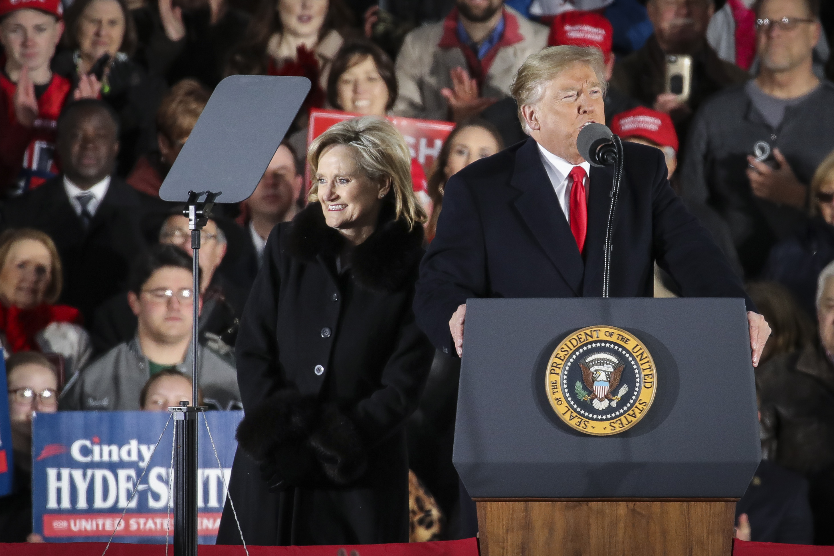 (L-R) Republican candidate for U.S. Senate Cindy Hyde-Smith is introduced by President Donald Trump during a rally at the Tupelo Regional Airport, November 26, 2018, in Tupelo, Mississippi. President Trump is holding two rallies on Monday in Mississippi, in support of Republican candidate for U.S. Senate Cindy Hyde-Smith, who faces off against Democratic candidate Mike Espy in a runoff election on Tuesday. (Photo by Drew Angerer/Getty Images)