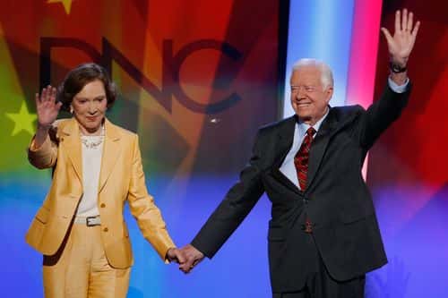 Former U.S. President Jimmy Carter (R) and former first lady Rosalynn Carter wave on stage during day one of the Democratic National Convention (DNC) at the Pepsi Center August 25, 2008 in Denver, Colorado. The DNC, where U.S. Sen. Barack Obama (D-IL) will be officially nominated as the Democratic candidate for U.S. president, starts today and finishes August 28th. (Photo by Mark Wilson/Getty Images)