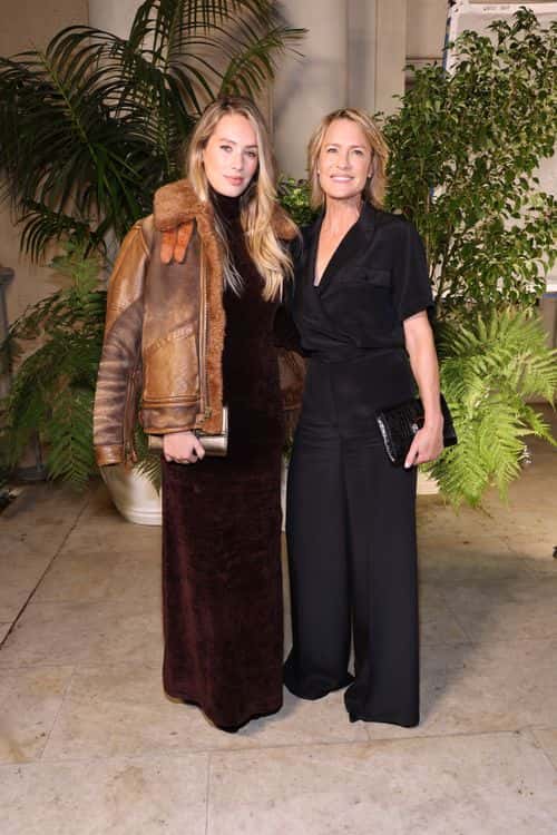 (L-R) Dylan Penn and Robin Wright attend the Ralph Lauren SS23 Runway Show at The Huntington Library, Art Collections, and Botanical Gardens on October 13, 2022 in San Marino, California.