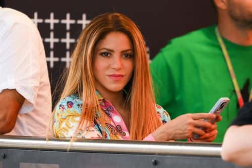 Shakira texts on his mobile phone as she watches the action during the F1 Grand Prix of Spain at Circuit de Barcelona-Catalunya on June 04, 2023 in Barcelona, Spain.