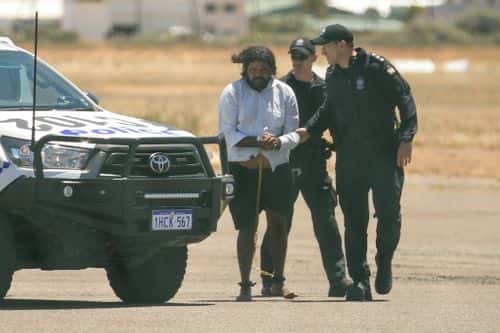 Terence Darrell Kelly boards a plane after being taken into custody by members of the Special Operations Group at Carnarvon airport on November 5, 2021 in Carnarvon , Australia. Kelly, 36, has been charged with various offences relating to the disappearance of Cleo Smith, 4, who was abducted from a campsite in the Gascoyne region on October 16th and found alive on November 3rd. He is being transported to Perth and will re-appear in court In December.