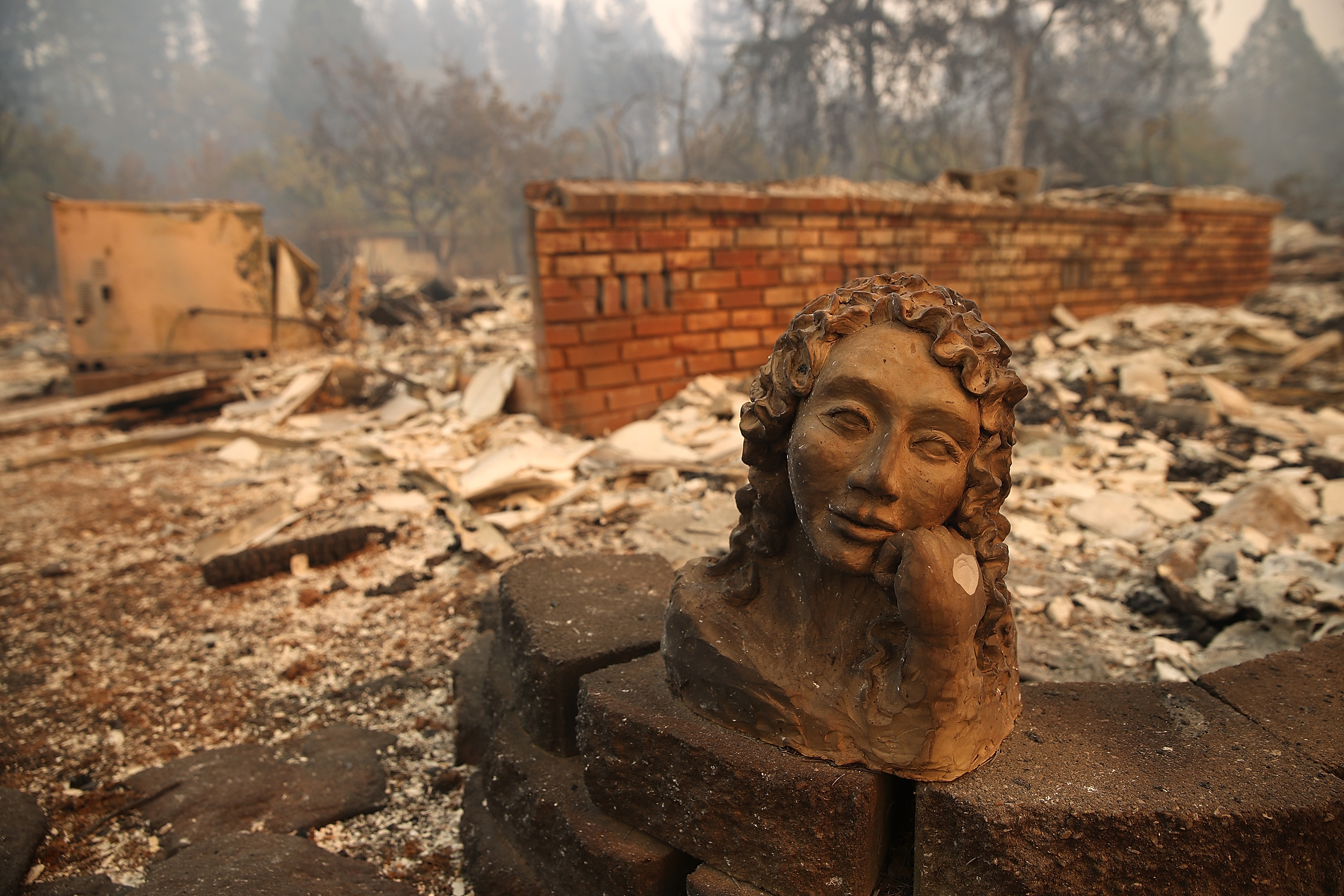 A statue remains in front of a home that was destroyed by the Camp Fire on November 10, 2018, in Paradise, California. (Getty)