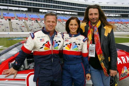 (L-R) NASCAR TV analyst Wally Dallenbach, actress Minka Kelly and Minka's father Musician Rick Dufay pose for a photo during practice for the NASCAR Nextel Cup Series Dickies 500, on November 4, 2006 at Texas Motor Speedway in Fort Worth, Texas.