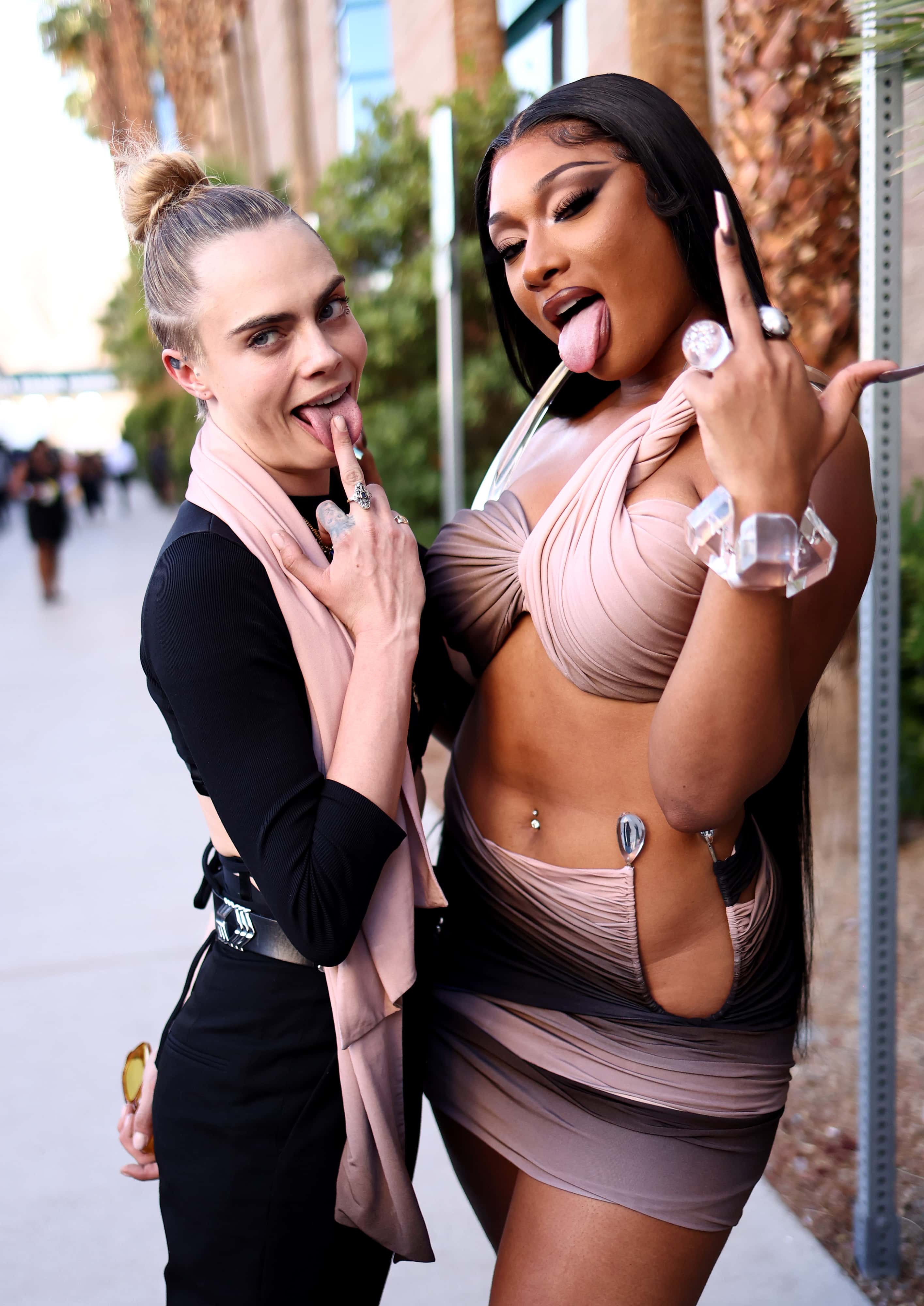(L-R) Cara Delevingne and Megan Thee Stallion attend the 2022 Billboard Music Awards at MGM Grand Garden Arena on May 15, 2022 in Las Vegas, Nevada.