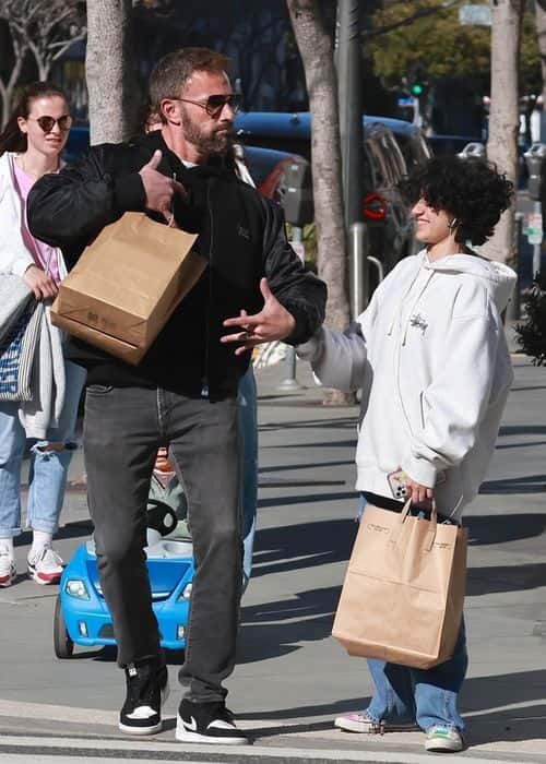 Gone Girl actor, 51, and the 15-year-old made their way around the city to shop and grab some food as they sported smiles on their faces the entire time (Backgrid)