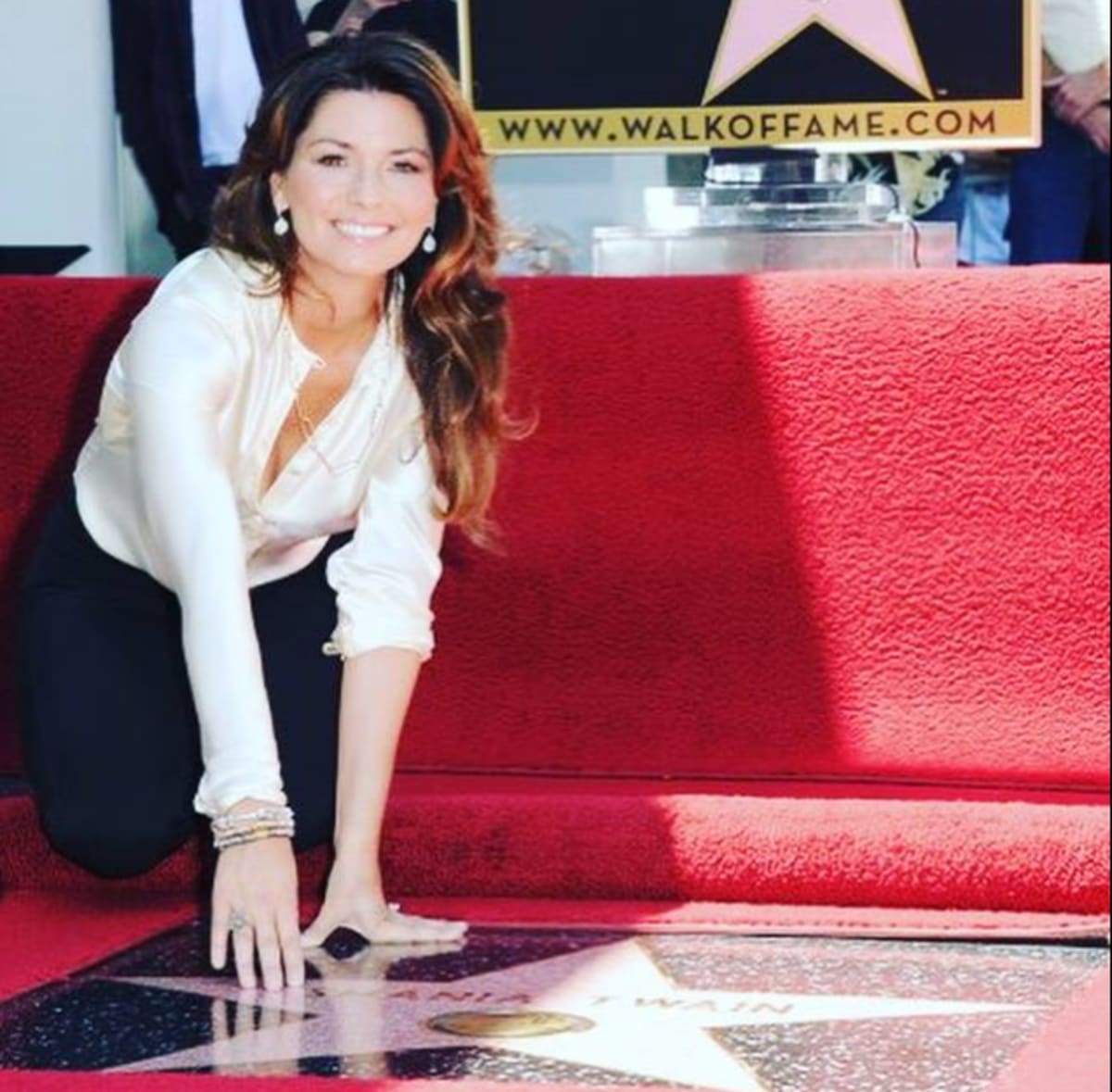 The proud mom of one looked pretty in a white button-up top and black bottoms while being honored with a star on The Hollywood Walk Of Fame in 2011 (