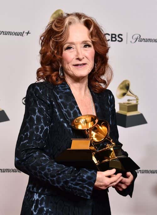 Bonnie Raitt poses with the Best American Performance Award for