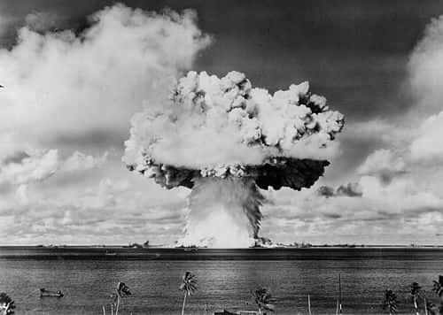 An atomic cloud rises July 25, 1946 during the