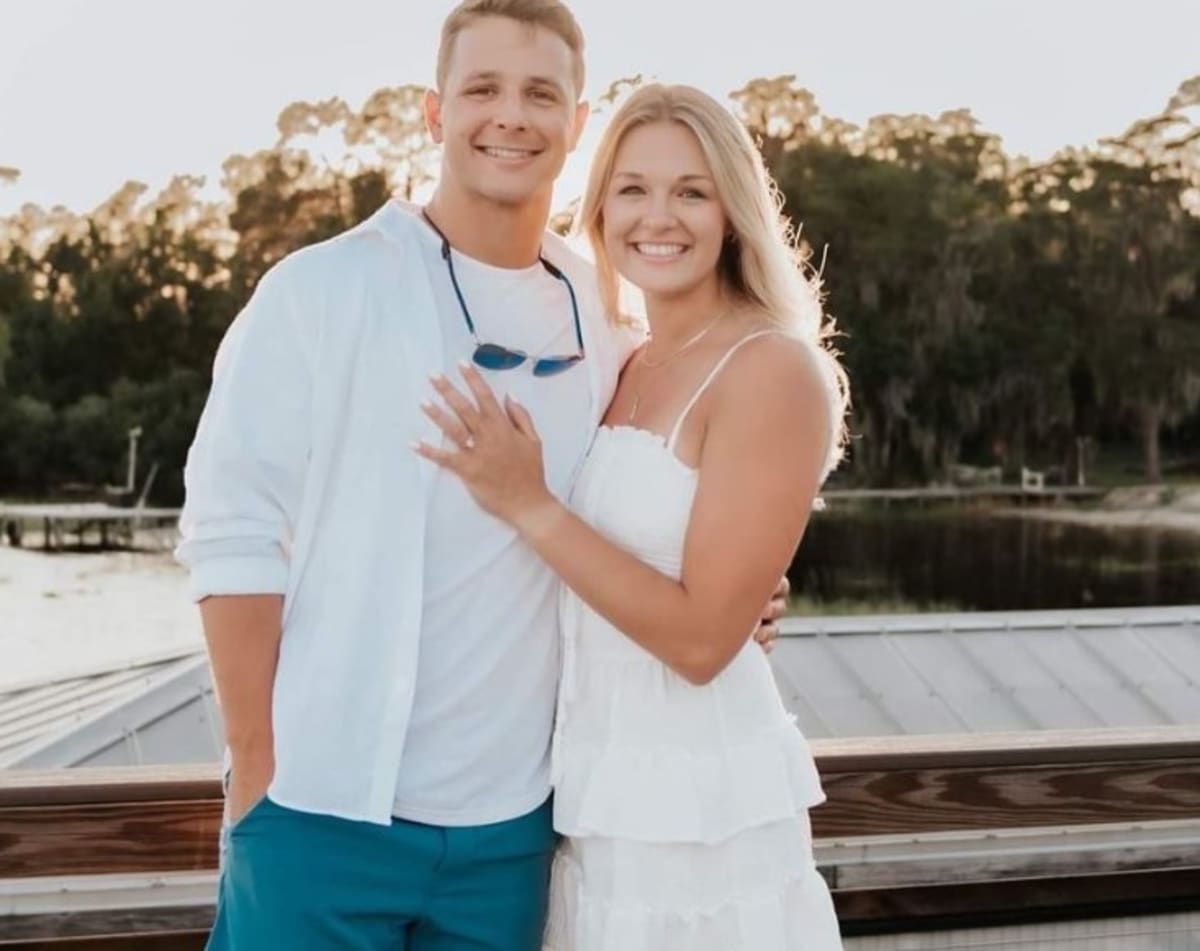 Brock Purdy over fiancée Jenna Brandt as he proposes to her (brock.purdy13/Instagram)