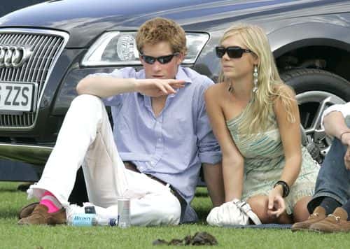 Prince Harry and his girlfriend Chelsy Davy attend the Cartier International Polo match at the  Guards Polo Club on 30 July, 2006 in Egham, England.