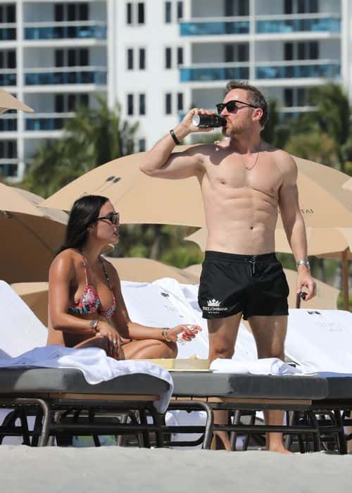 David Guetta displays toned abs while holidaying at Miami beach with girlfriend Jessica Ledon. (Backgrid)