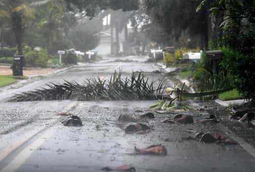 Debris litters a street in a neighborhood of St. Pete Beach as the winds from Hurricane Ian arrive on September 28, 2022 in St. Petersburg, Florida. Ian is hitting the area as a Category 4 hurricane.