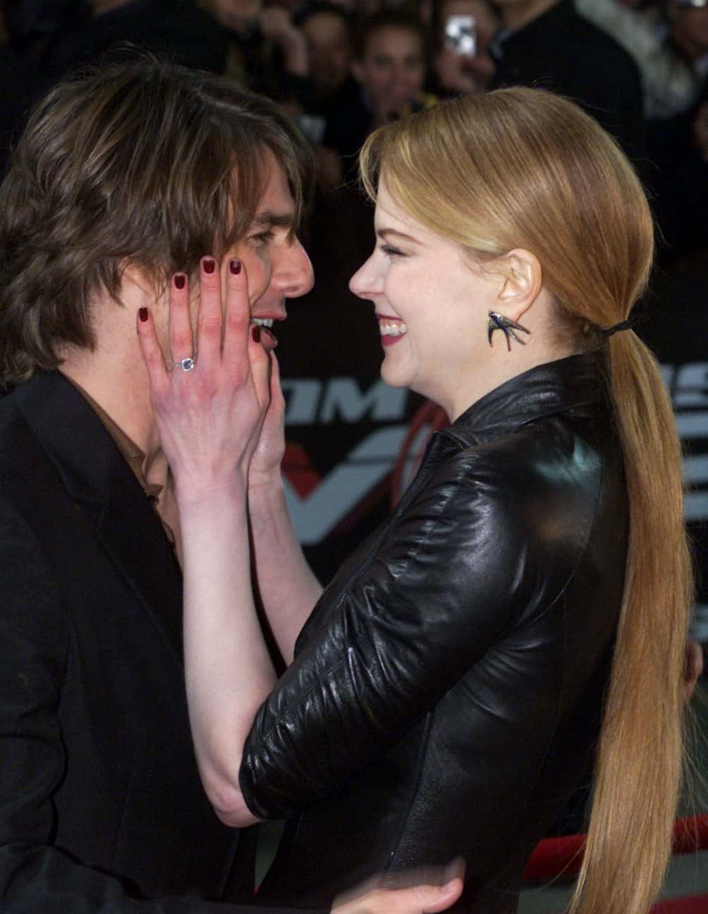 Actor Tom Cruise and his wife Nicole Kidman embrace each other at the Sydney premiere of 
