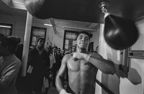 American boxer Muhammad Ali (1942-2016) training with a speed bag ahead of his fight against Britain's Brian London, in London, England, 3rd August 1966. (Photo by R McPhedran/Daily Express/Hulton Archive/Getty Images)