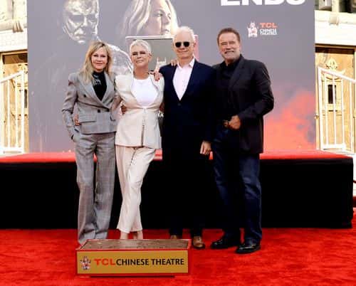 (L-R) Melanie Griffith, Jamie Lee Curtis, Christopher Guest and Arnold Schwarzenegger attend the Jamie Lee Curtis Hand and Footprint In Cement Ceremony at TCL Chinese Theatre on October 12, 2022 in Hollywood, California.