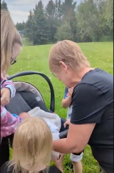 mom suprises with new baby (Photo via Tiktok)