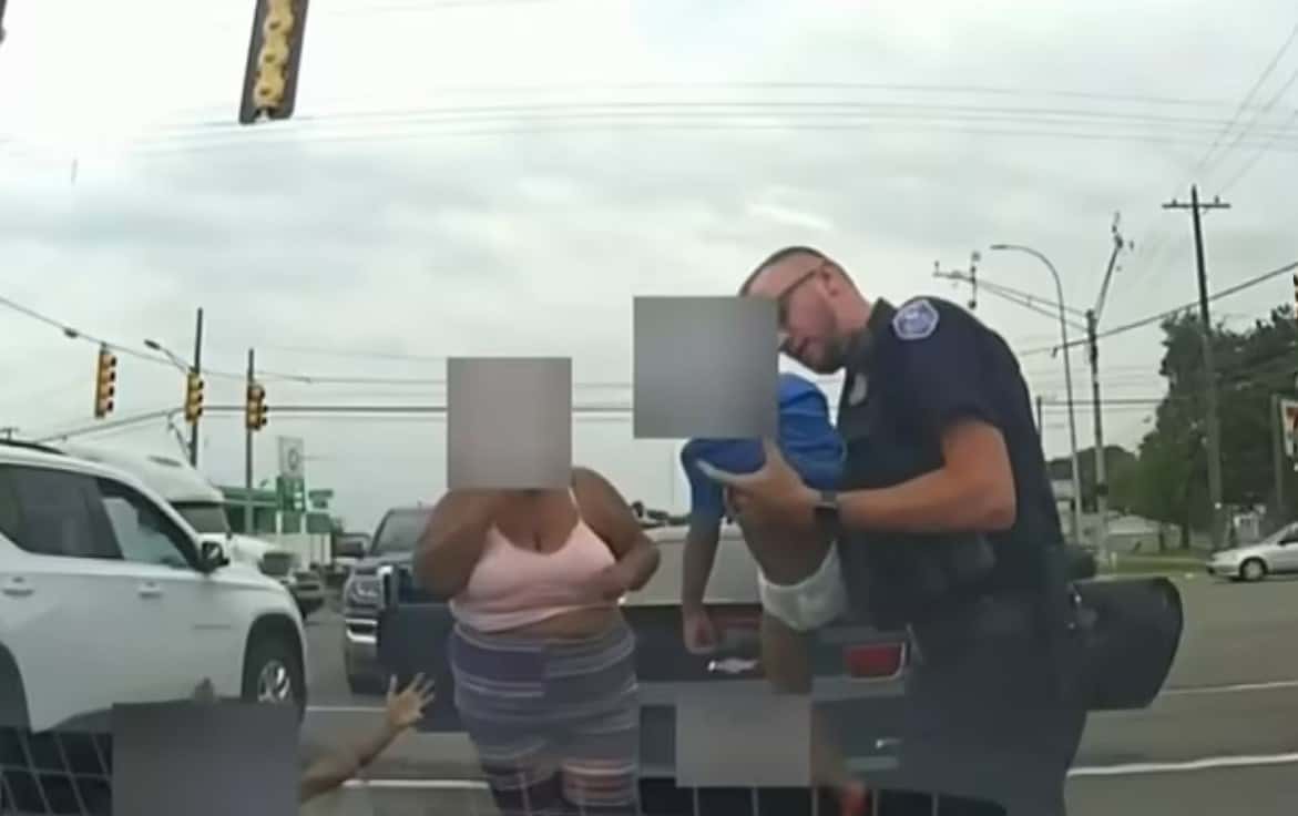 Officer Fraser saving the boy (Screenshot/ClickOnDetroit)